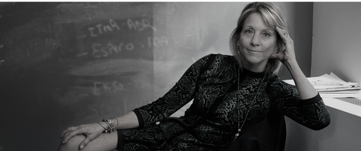 Business woman sitting in chair leaning back