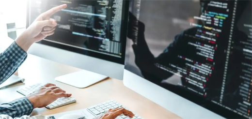 a person pointing at a computer screen