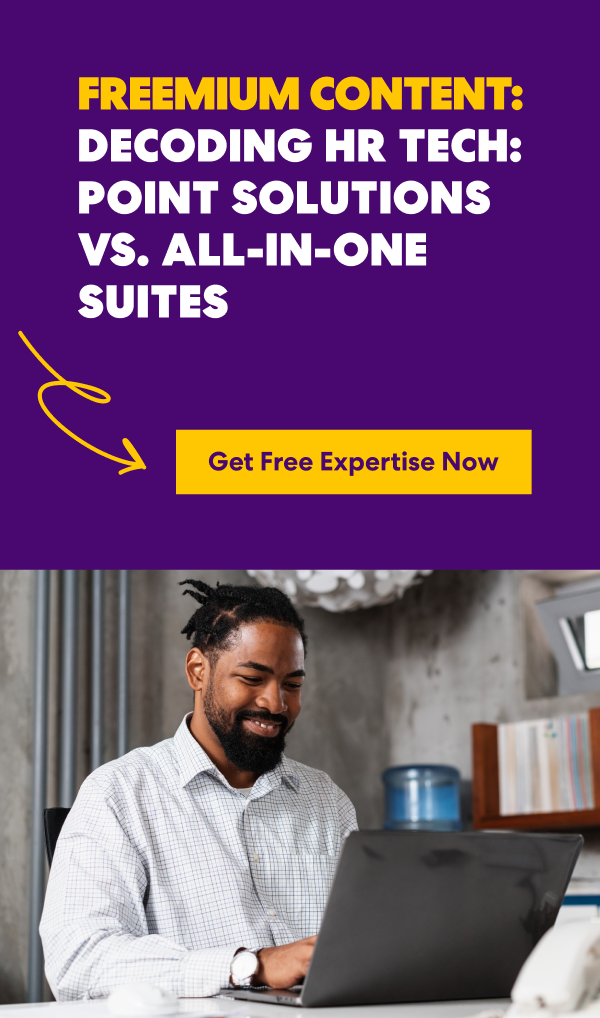 Man using a laptop next to text promoting a free guide comparing HR point solutions and all-in-one suites.